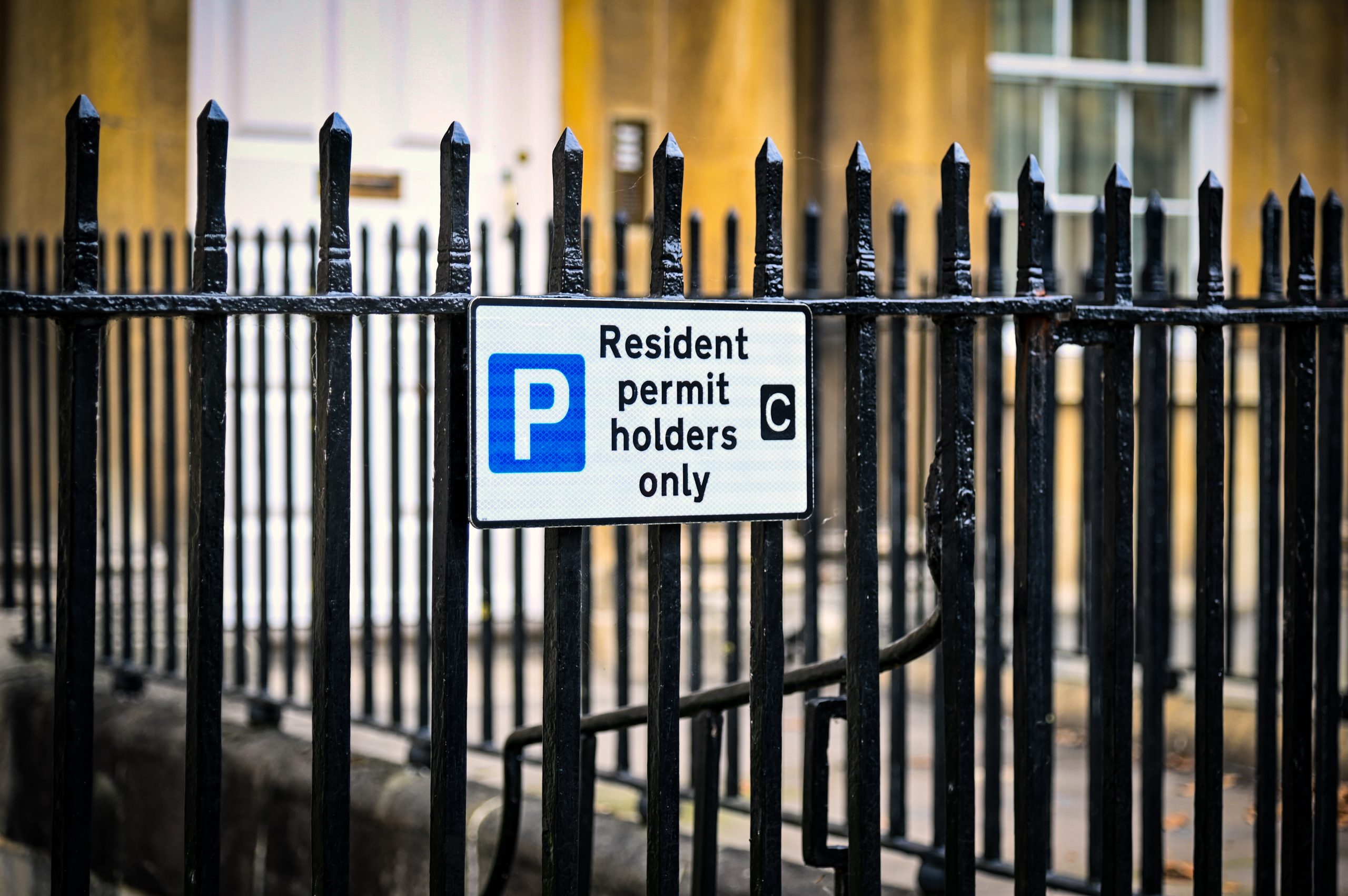 Resident permit sign on railings