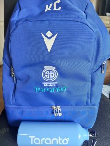 blue rucksack with water bottle